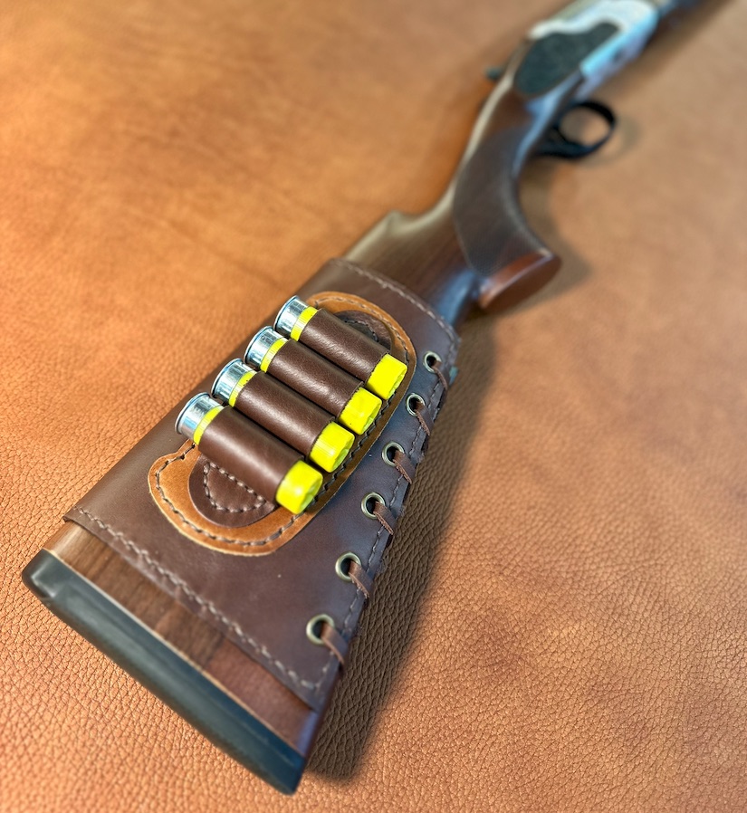 Leather shotgun shell holder mounted on stock